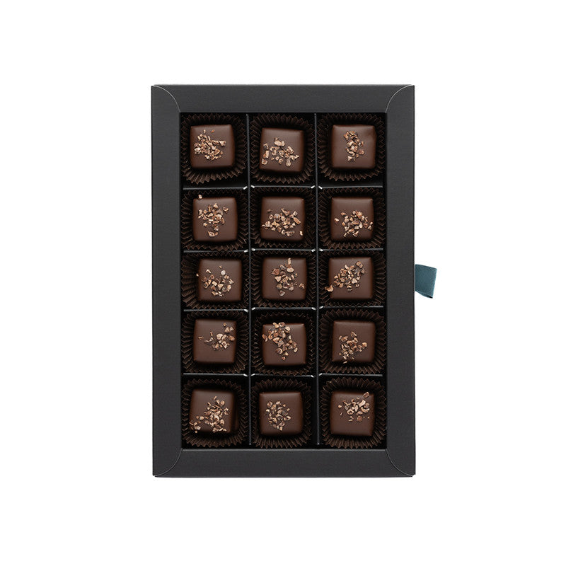 TUMŠĀS ŠOKOLĀDES KONFEKTES AR APELSĪNIEM UN JŪRAS SĀLI "SLEPENĀ MĪLA'', 130g